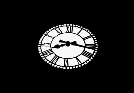 Retro Clock on a black background. Night watch. Minimalism.の写真素材