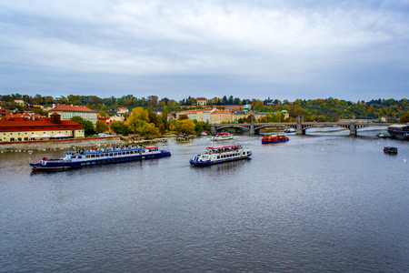Beautiful architecture on the river. Prague. The boat on the water.の写真素材