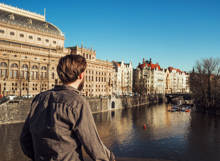 A man looks at the river. Prague.の写真素材