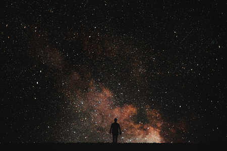 Silhouette of man on a background of stars..Man desires guess looking at the stars.の写真素材