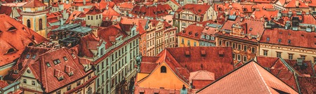 View to the colorful roofs and houses of Vysegrad in Prague, Czech Republic at autumn - aerial image, travel seasonal vintage hipster backgroundの写真素材