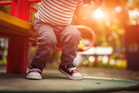 Child on the playground in the evening. Great plan.の写真素材