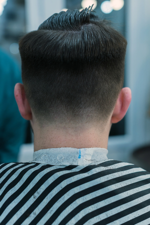 Men's haircut machine. Men's haircut in barbershop.の写真素材