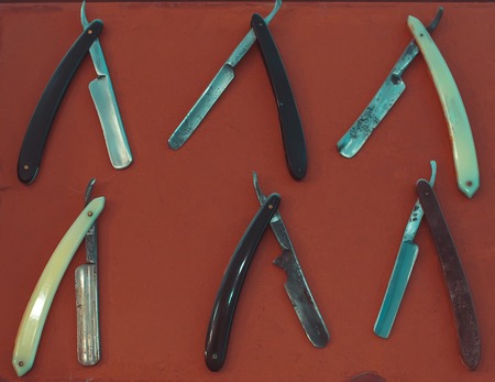 Razor on res background. Straight razor for men's grooming.の写真素材