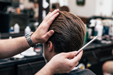 Men's haircut and styling in barbershop. Stylish Haircut Haircut.の写真素材