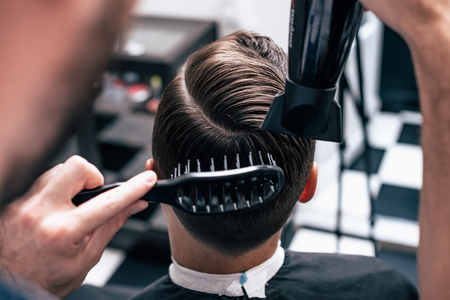 Men's haircut and styling in barbershop. Stylish Haircut Haircut.の写真素材