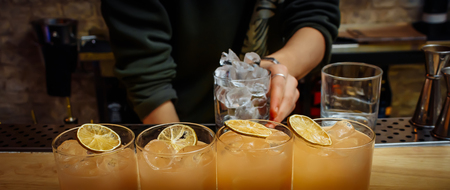 Ready for a yellow fruit and ice cocktail.の写真素材