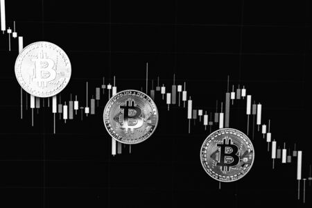 Bitcoin on a black and white background. Cryptocurrency trading.の写真素材