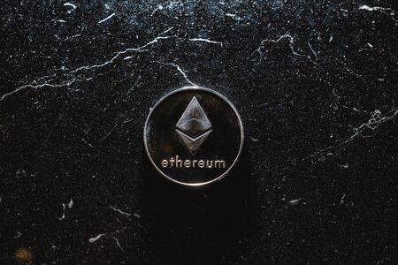 Bitcoin on a dark background. Ethereum and bitcoin rise and fall in price.の写真素材