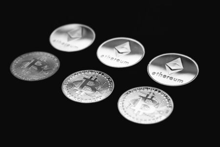 Bitcoin on a black and white background. Cryptocurrency trading. Financial dependence on cryptocurrency.の写真素材