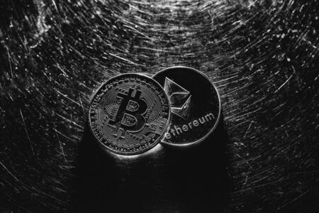 Bitcoin on a dark background. Ethereum and bitcoin rise and fall in price.の写真素材