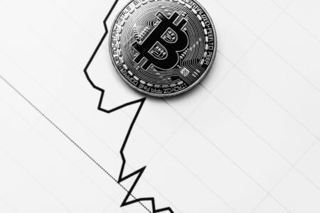 Bitcoin on a black and white background. Cryptocurrency trading. Financial dependence on cryptocurrency.の写真素材