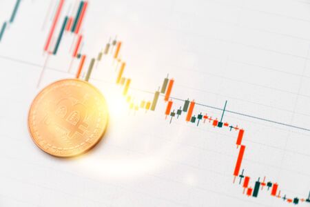 Bitcoin on white graph. New online currency.の写真素材