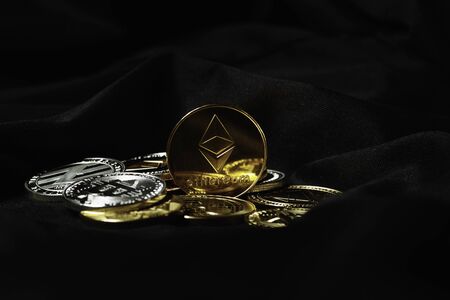 Cryptocurrency coin on black background. The world crisis. Electronic currency.の写真素材