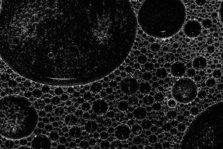 Foam on black background. Soft focus. Black and white photoの写真素材