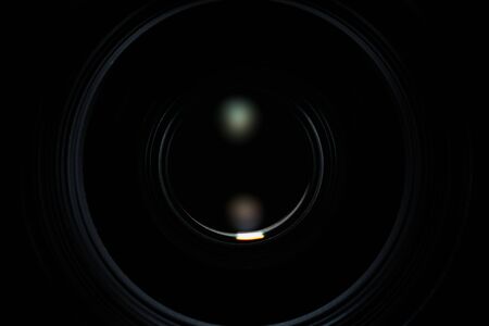 Hidden camera. Camera lens on in the dark. Camera trackingの写真素材