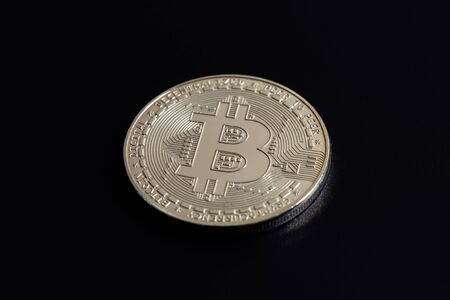 Bitcoin on black background. Cryptocurrency trading. Macro photoの写真素材