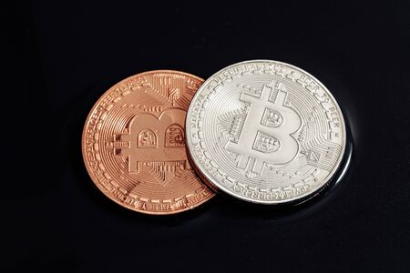 Bitcoin on black background. The world economic crisis.の写真素材