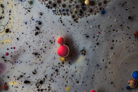 Abstract background from acrylic paints and oil. Macro photo