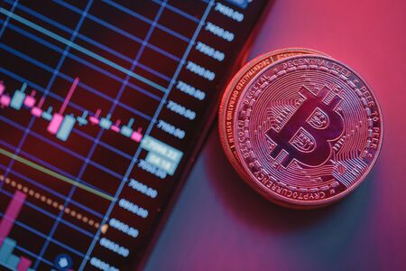 Cryptocurrency chart and bitcoin. Close-up photo. Tの写真素材