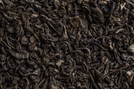 Texture of tea. Dry green tea leaves.の写真素材