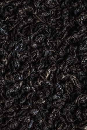 Texture of tea. Dry black tea leaves.の写真素材