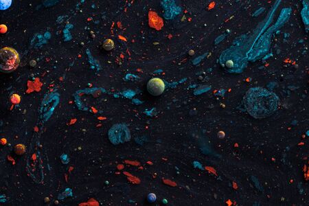 Amazing multi colored bubbles of paint on the oil surface.の写真素材
