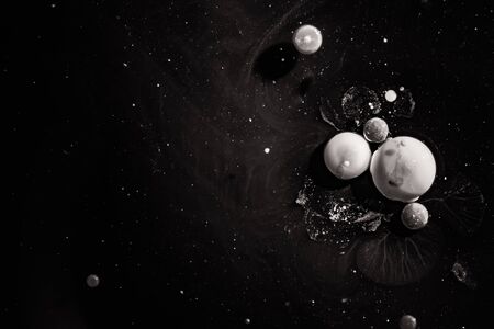 Paint in water. Amazing macro photography in the form of space and planets.の写真素材