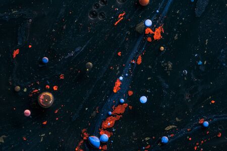 Amazing multi colored bubbles of paint on the oil surface.の写真素材