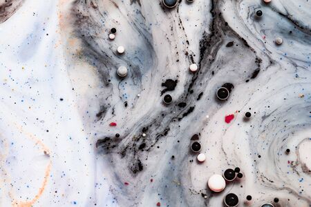 Bright colorful acrylic paint. Fantastic surface with Chaotic motion liquid. Top view. Macro structure of Multicolored Bubbles Paint and Oil.の写真素材
