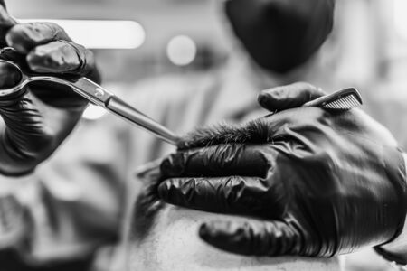 Mens haircut in a barbershop. Styling and hair care.の写真素材