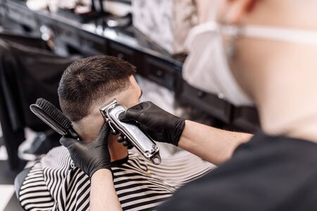 Mens beauty salon. Mens haircut in a barbershop.の写真素材