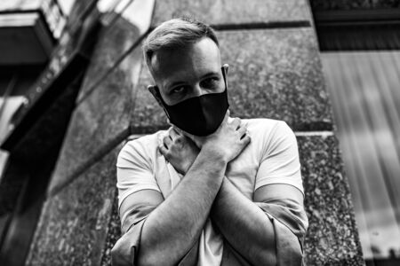 The mask strangles a person. Quarantine in the city.