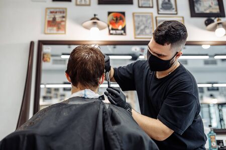 Thinning and styling hair. Hairdresser makes a haircut to the client.の写真素材