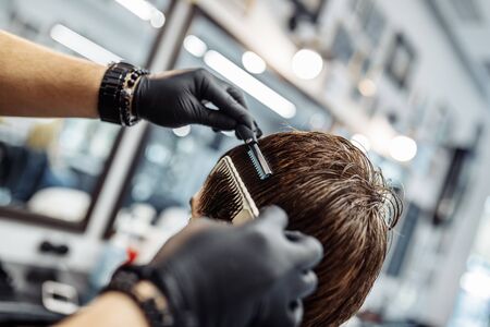 Thinning and styling hair. Hairdresser makes a haircut to the client.の写真素材