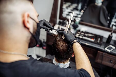 Creating a cool haircut and styling in a barbershop.の写真素材