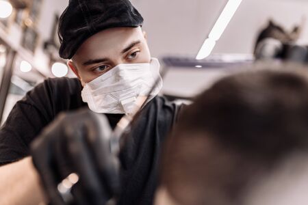 Haircut in quarantine. Haircut in masks from the virus. Hair and health care.の写真素材