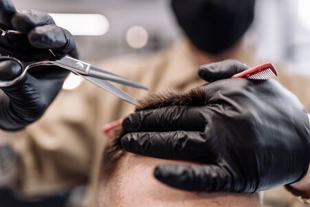 Mens haircut in a barbershop. Styling and hair care.の写真素材