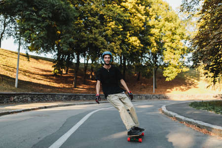The guy rides on a board at sunset.の写真素材