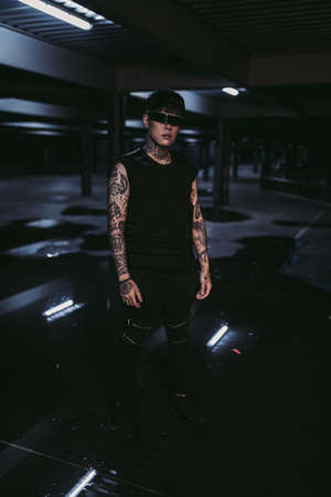 Special man standing in a dark city. Cyberpunkの写真素材