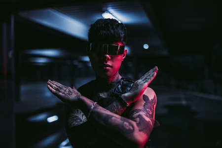 Stop. New cyber addiction. Cyberpunk and fashion 2020. The guy in cyber glasses.