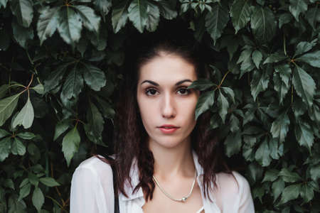 Portrait of a woman in the bushesの写真素材