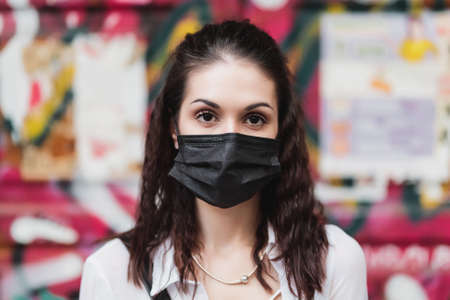 Young woman in a black mask. Protection against Ñovid-19の写真素材