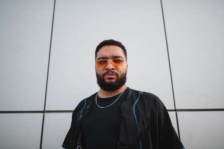 Portrait of a stylish man on the city streets.の写真素材
