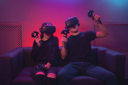 VR Battle on the couch. People spend time in the game.