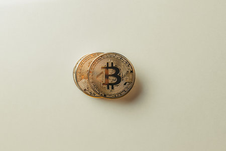 Bitcoin on a yellow background.の写真素材