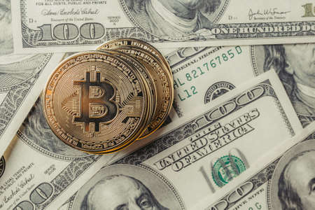 Bitcoins on dollars.の写真素材