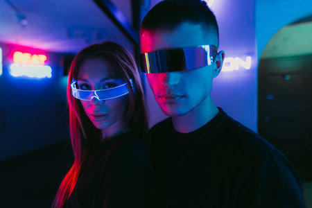 Man and woman in futuristic style. Neon noirの写真素材