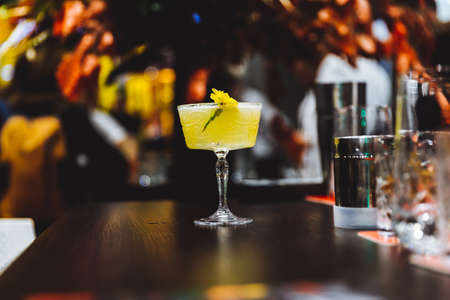 Yellow cocktail on the bar.の写真素材