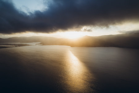Amazing sunset over the mountains among the ocean.の写真素材